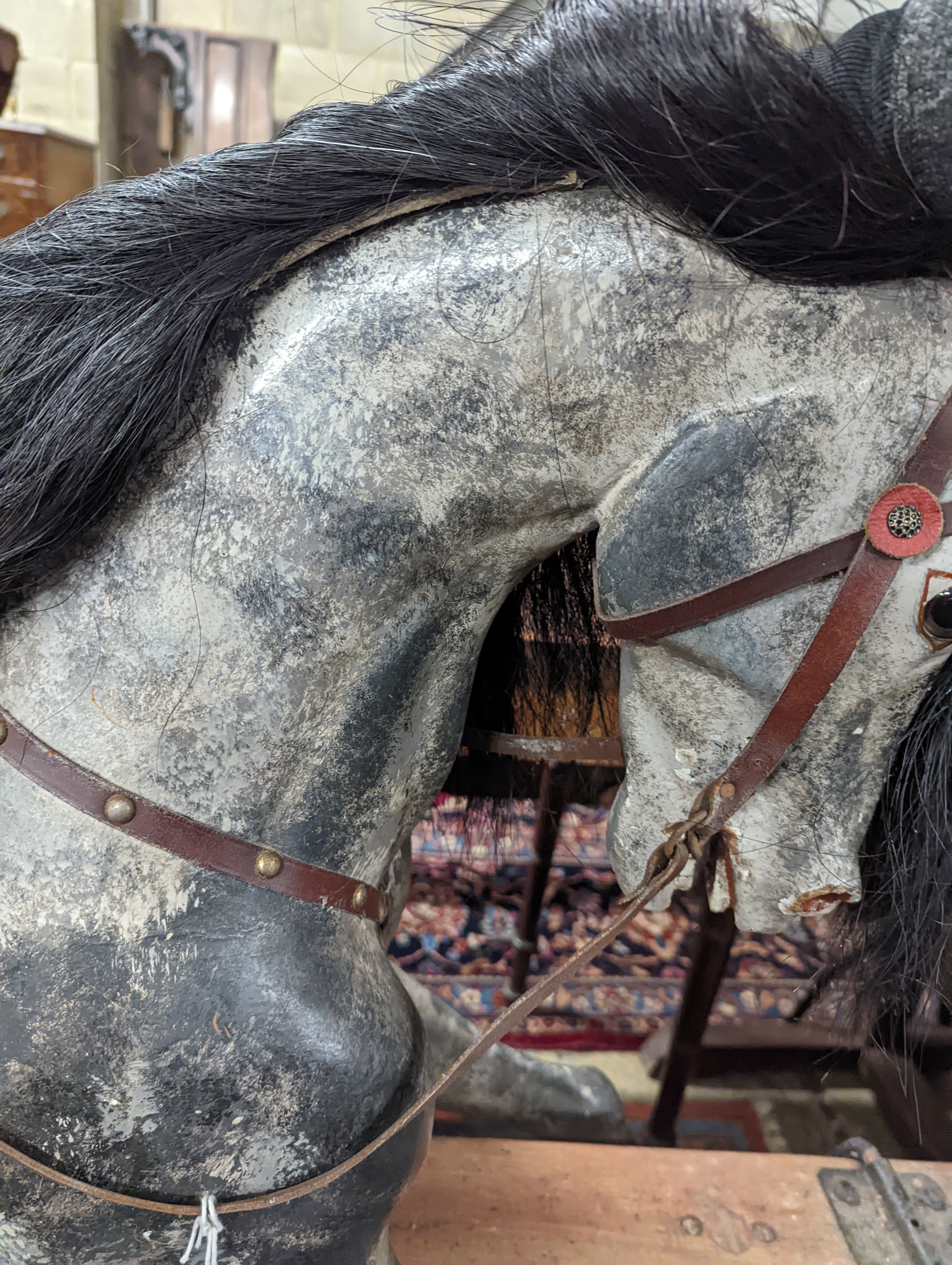 A large Edwardian Ayres type rocking horse on a turned safety frame, length 160cm, height 110cm